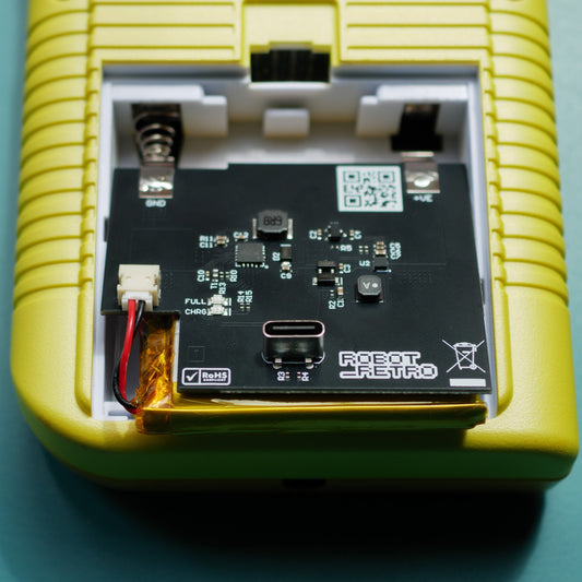 USB-C rechargeable 3000 mAh battery installed inside a classic Game Boy Original (DMG) console showing charging cable connected robot retro