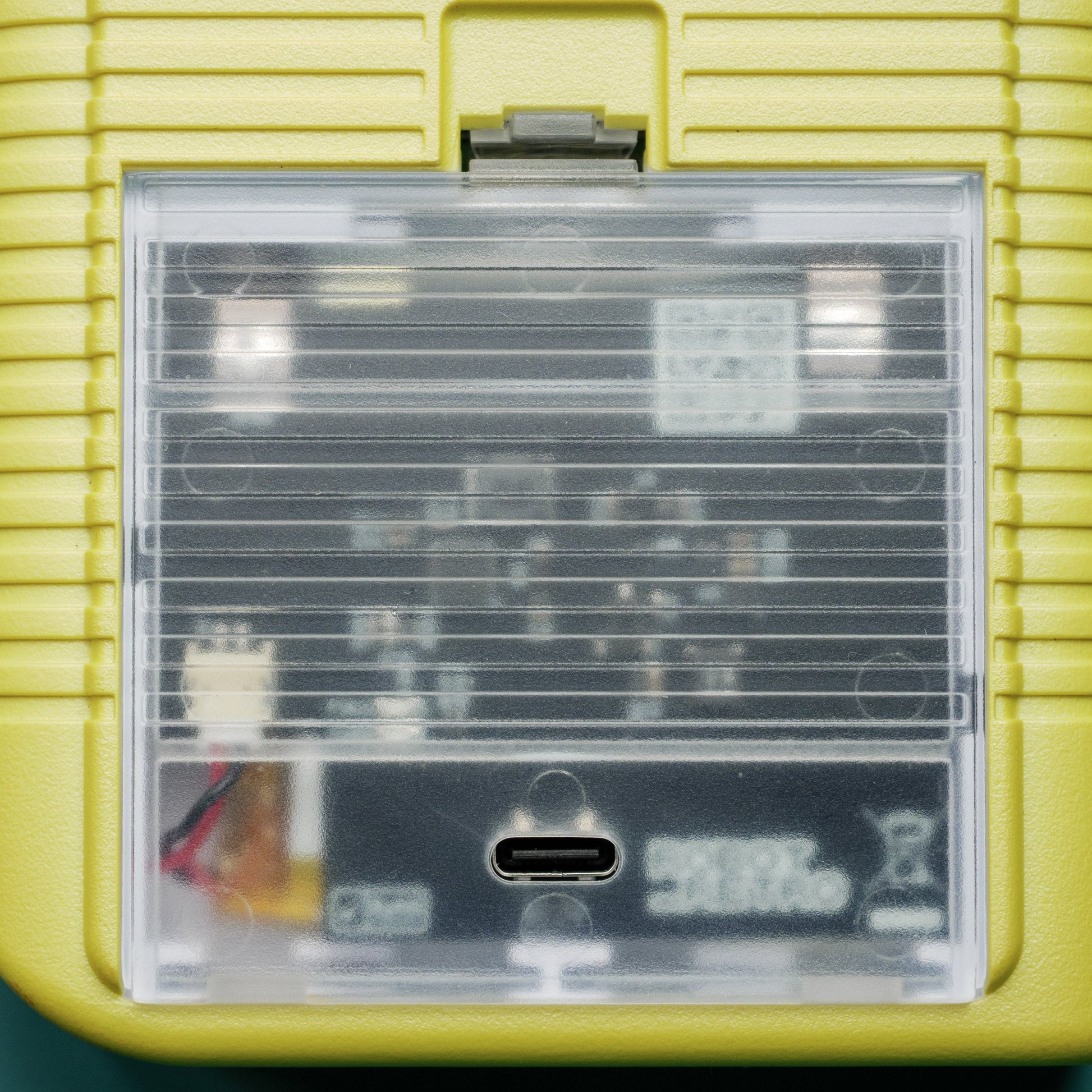 USB-C rechargeable 3000 mAh battery installed inside a classic Game Boy Original (DMG) console showing charging cable connected robot retro