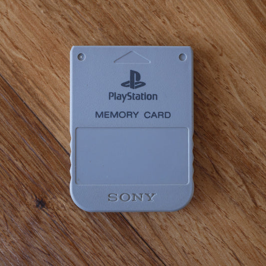 PlayStation memory card on a wooden surface