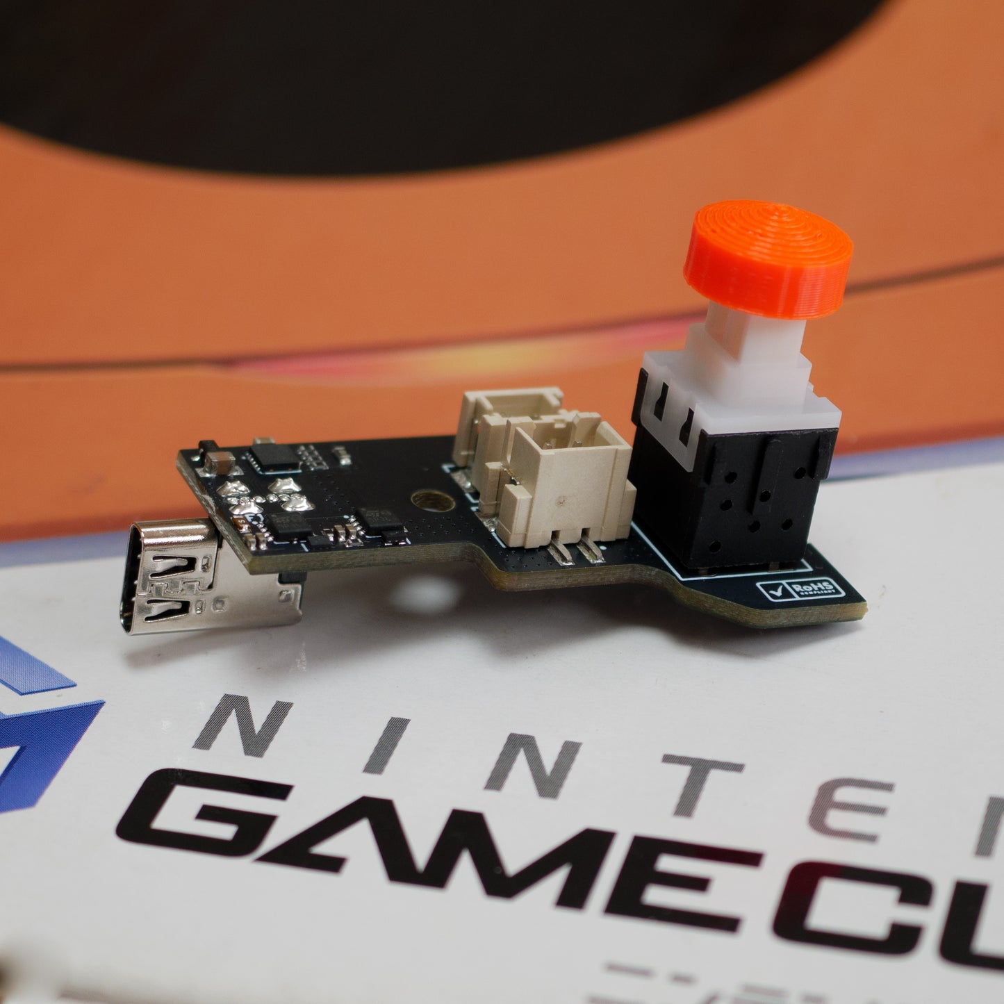 USB-C power supply for Gamecube console, modern replacement adapter providing safe and reliable power robot retro